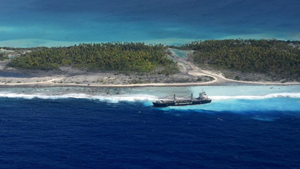 Large cargo ship runs aground on French Polynesia reef